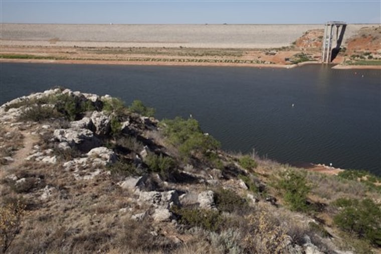 The dam and spillway at Lake Meredith National Recreation area reveals the receding water line that now sits beneath the spillway base near, Fritch, Texas, in this August 2011 photo.
